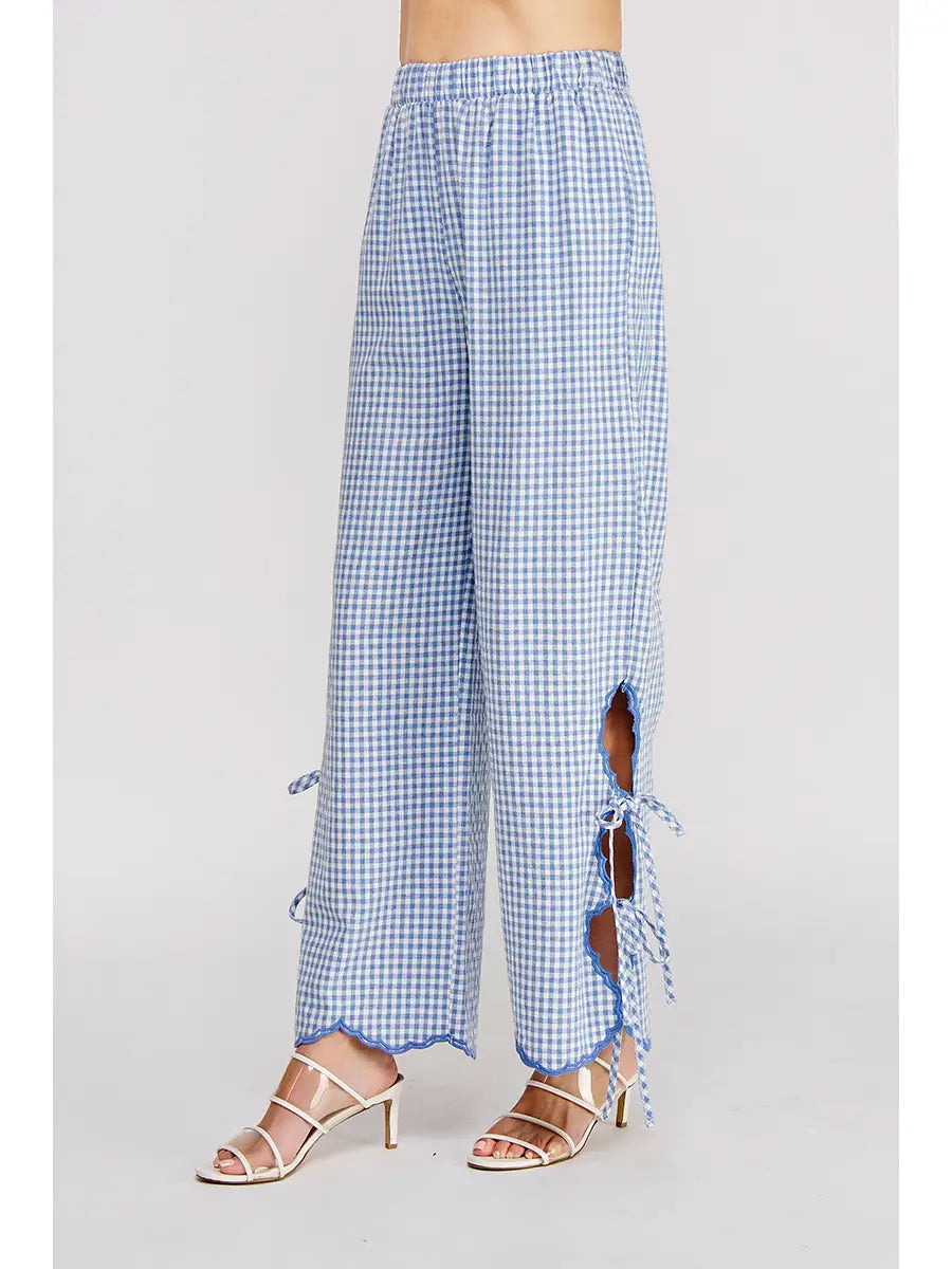 Blue checkered pants with a frayed edge on a white background