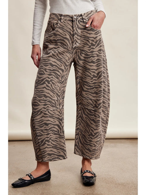 Women wearing zebra print barrel jeans. 