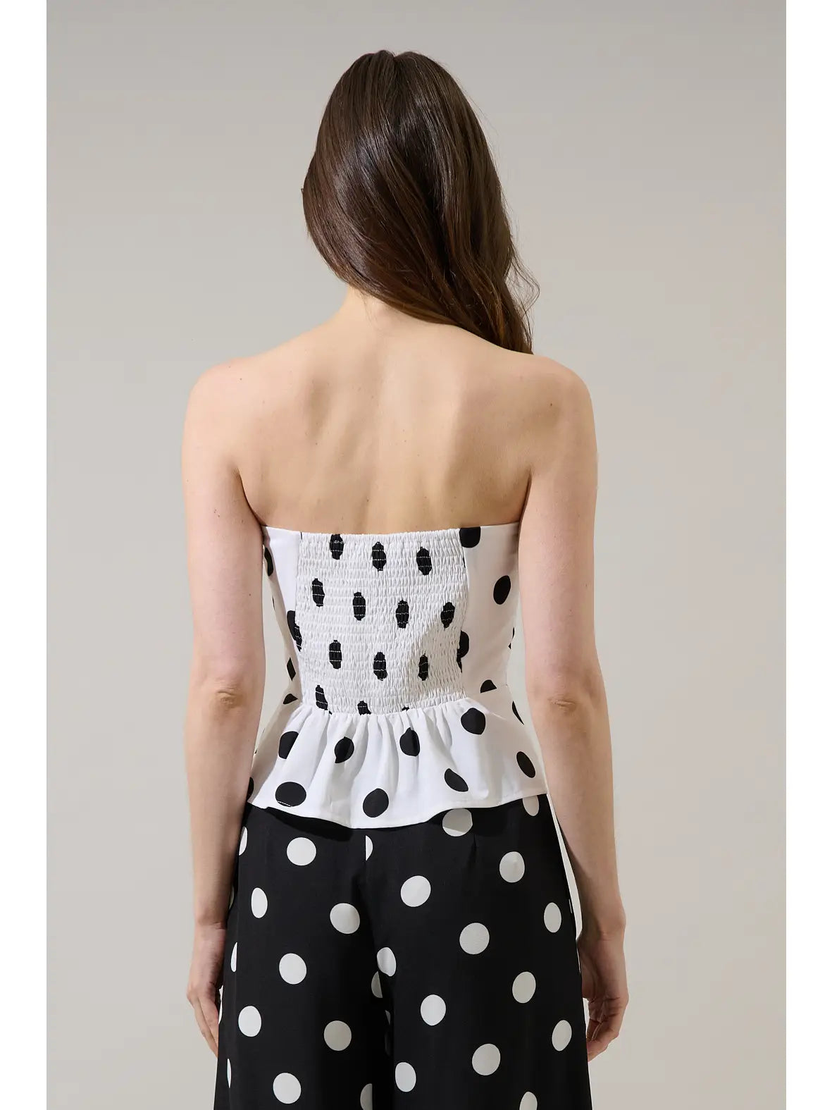 Polka dot top with smocked back.