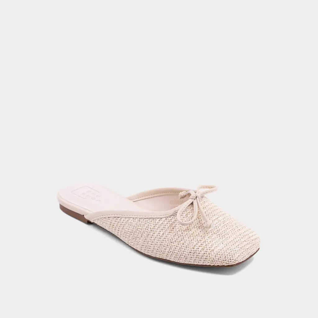 Beige woven flat shoe on a light gray background