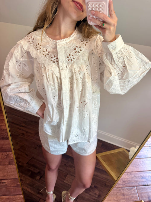Women in a white eyelet matching set. 