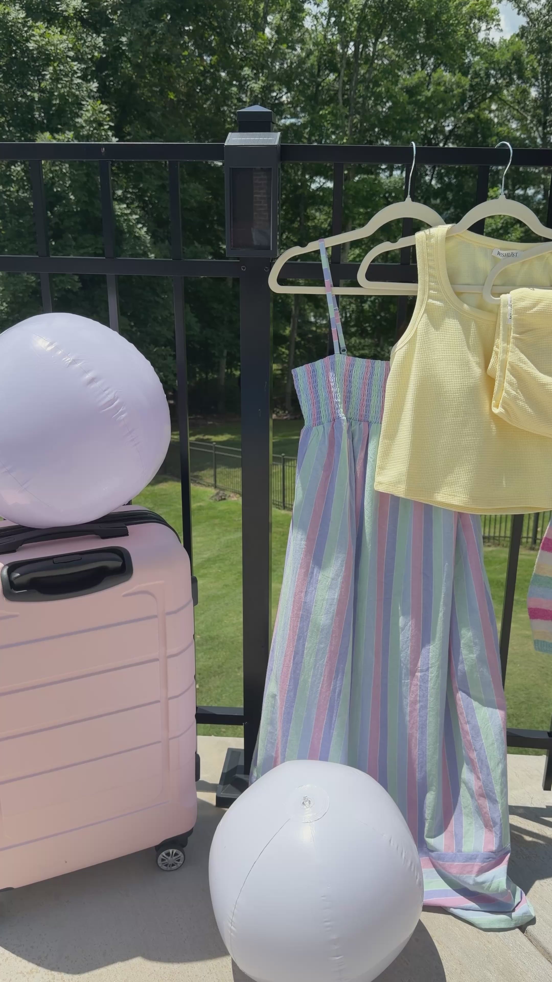 video of clothing items on a fence. 